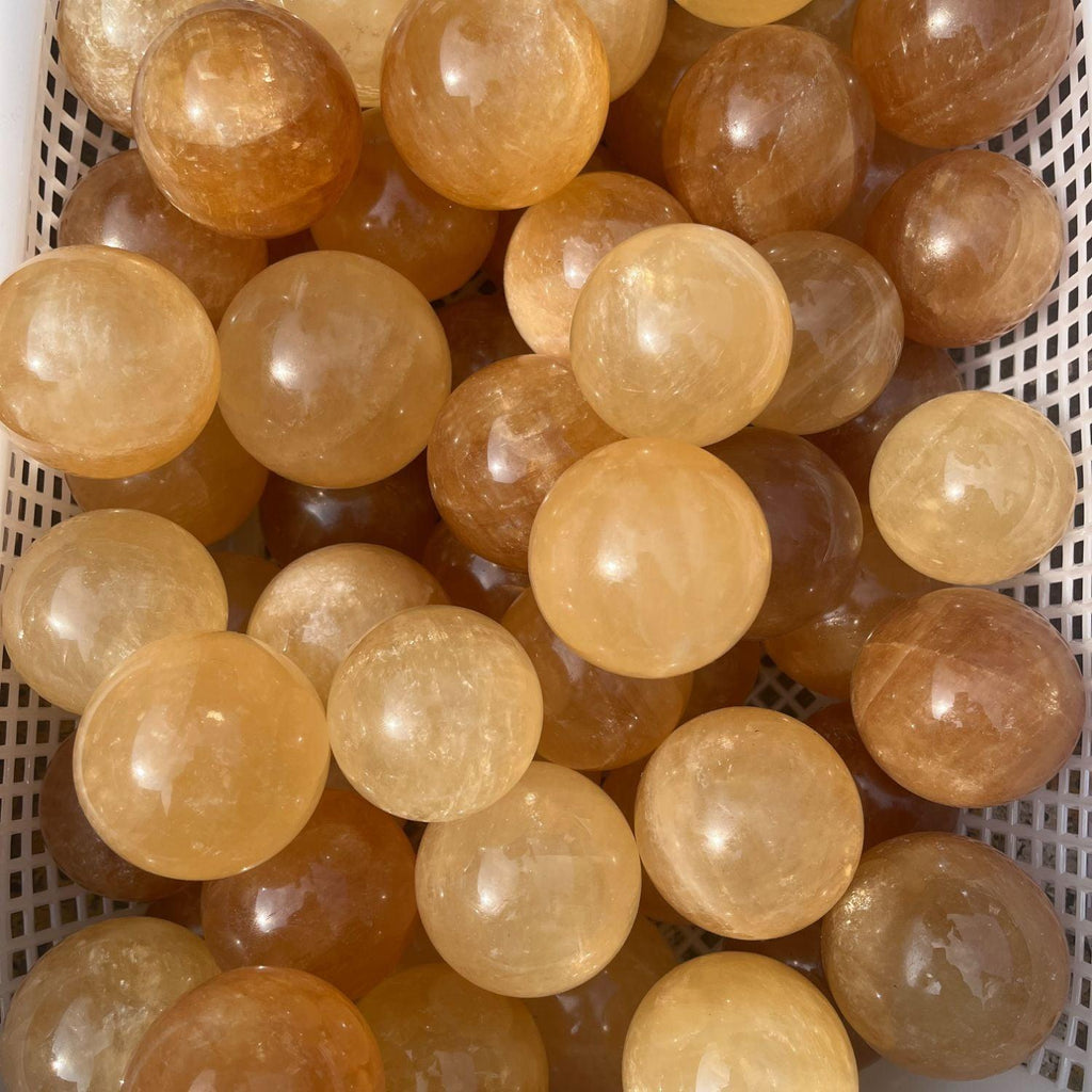5-7cm yellow calcite sphere Wholesale - Free Shipping Over 300USD - Price at $ 14.00 /pc