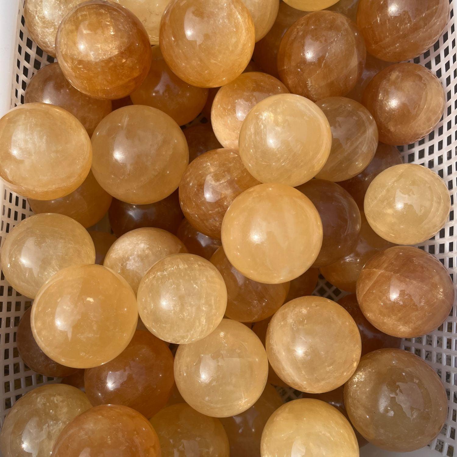 5-7cm yellow calcite sphere Wholesale - Free Shipping Over 300USD - Price at $ 14.00 /pc