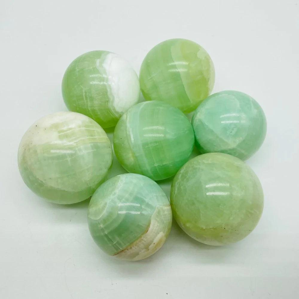 3-6CM green calcite sphere