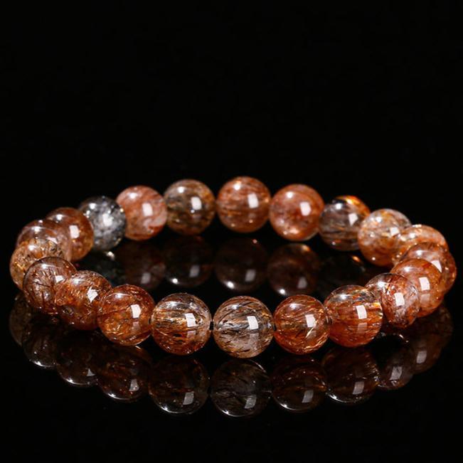 MLD Wholesale Crystals round polished golden rutilated beads black gold super 7 bracelet on black background