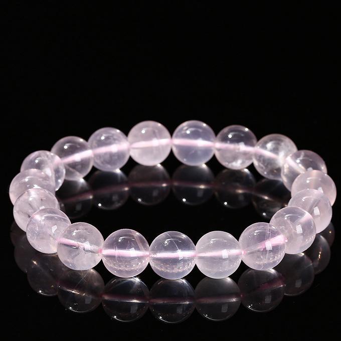 MLD Wholesale Crystals wholesale rose quartz star bracelet round polished beads stretch on black background