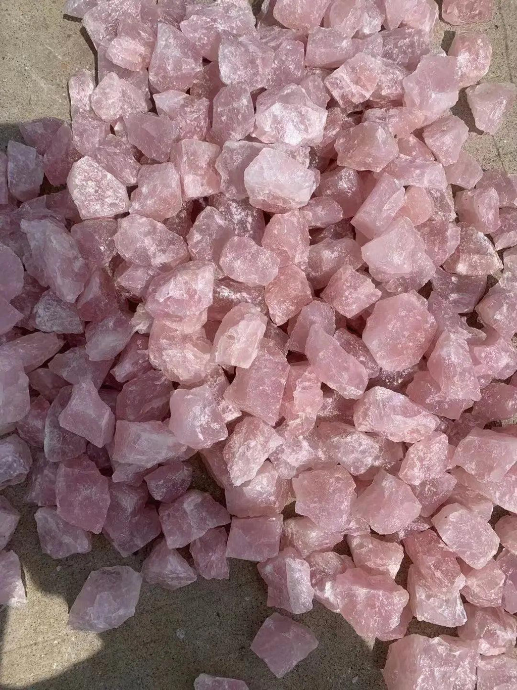 MLD Wholesale Crystals pile of loose pink rough chunks wholesale rose quartz raw stones for decor and jewelry