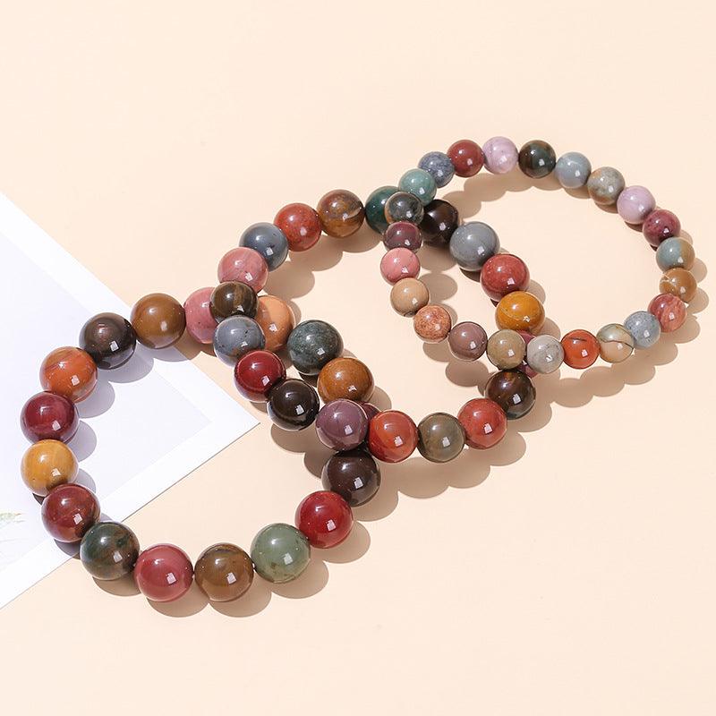 Alashan agate bracelet wholesale multicolor polished round bead stretch bracelets on beige background