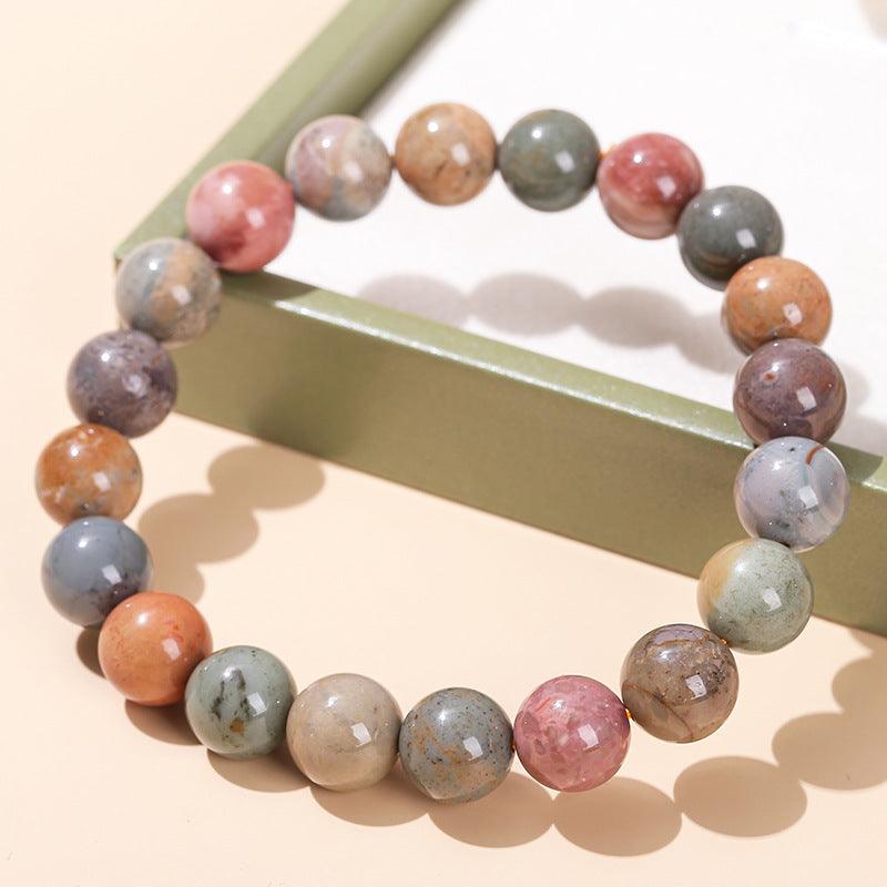 Alashan agate bracelet wholesale polished multicolor round beads on beige background with green box
