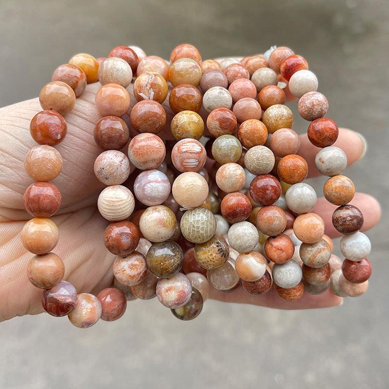 coral jade bracelet wholesale multiple round polished coral cream and peach jade bead stretch bracelets held in hand
