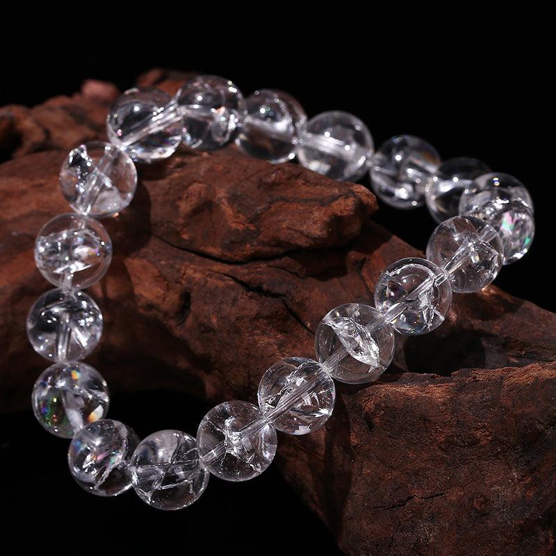 Clear round crystal bead Azeztulite bracelet wholesale on rustic wood display for healing jewelry retailers