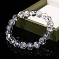 Azeztulite bracelet wholesale clear round rainbow flash beads on elastic displayed next to green gift box