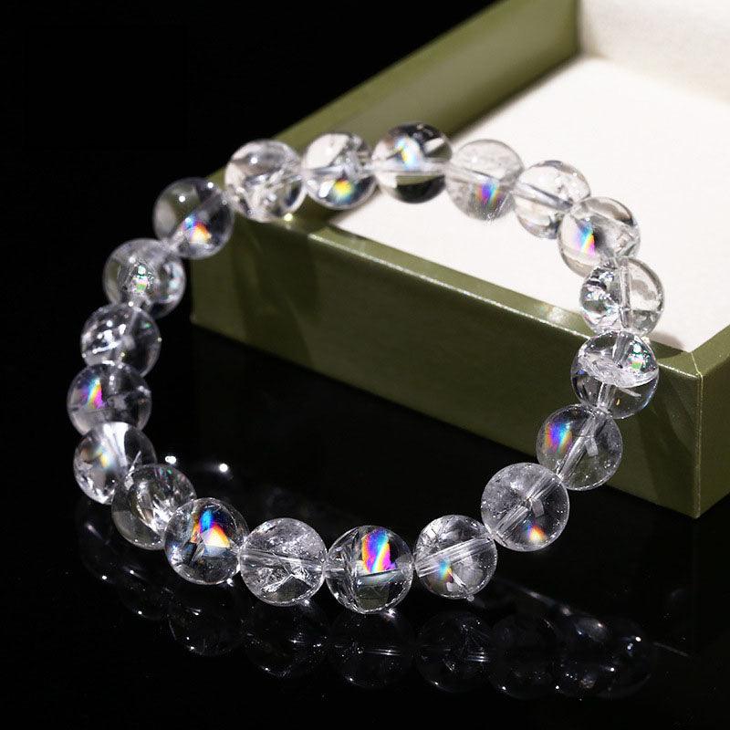 Azeztulite bracelet wholesale clear round rainbow flash beads on elastic displayed next to green gift box