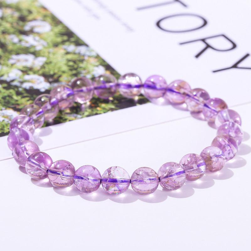 Azeztulite bracelet wholesale translucent purple round bead stretch bracelet on white magazine background