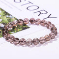 Azeztulite bracelet wholesale translucent round smoky pink crystal bead stretch bracelet on white background