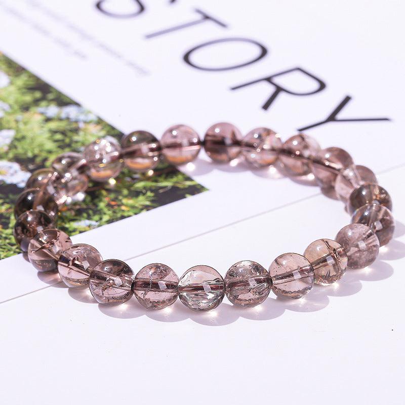 Azeztulite bracelet wholesale translucent round smoky pink crystal bead stretch bracelet on white background